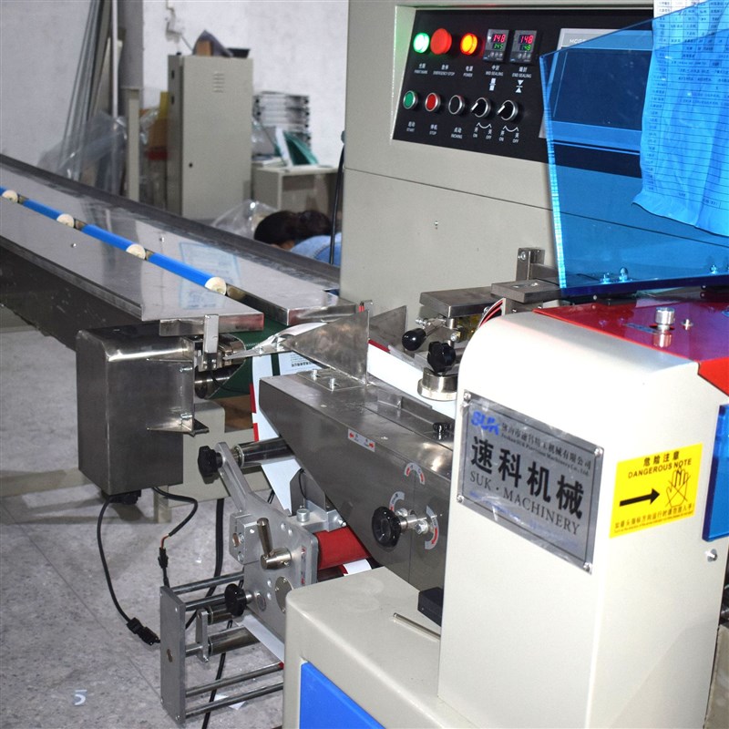 厂包4分微喷头及打金配件水平包装机在装设备理料喷码五包机中的应用